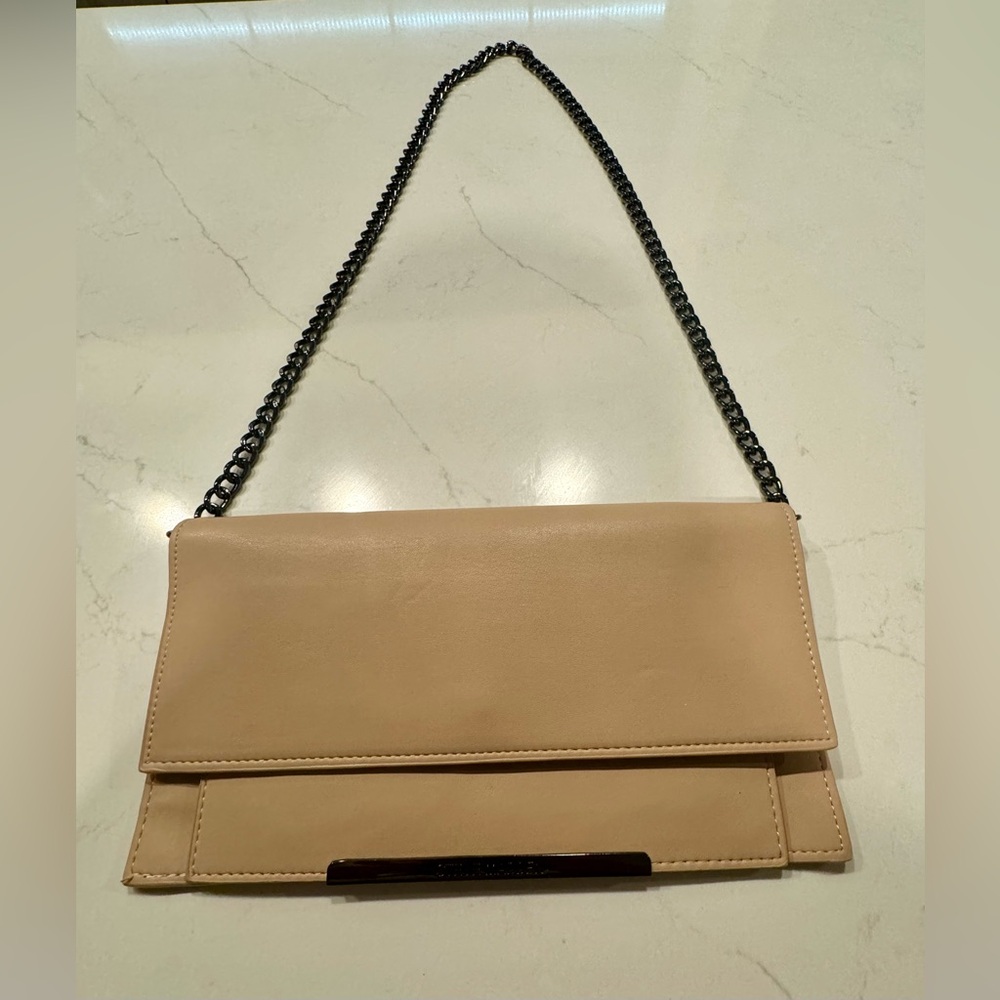 Never Used Steve Madden clutch w/black/pewter shoulder strap.